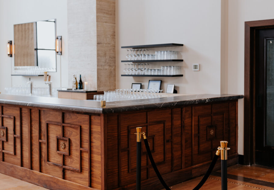Elegant wooden bar with marble countertop inside The Reserve a Grand Venue in Hammond Indiana.